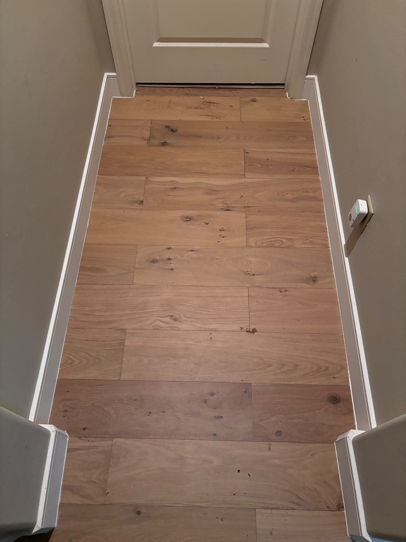 Finished hardwood at doorway threshold