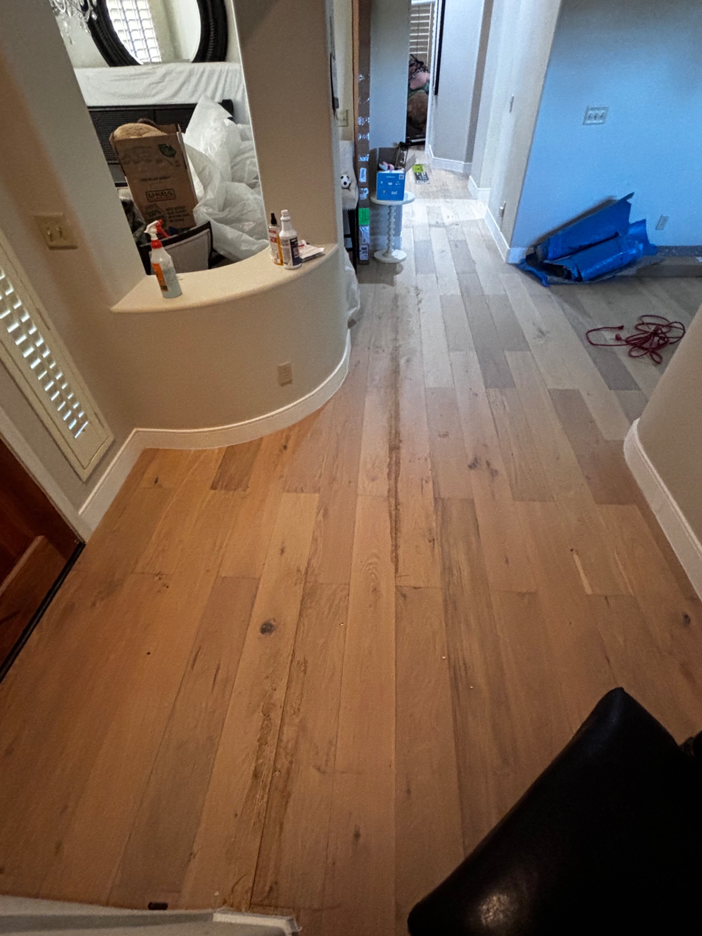 Finished hardwood transitioning between rooms