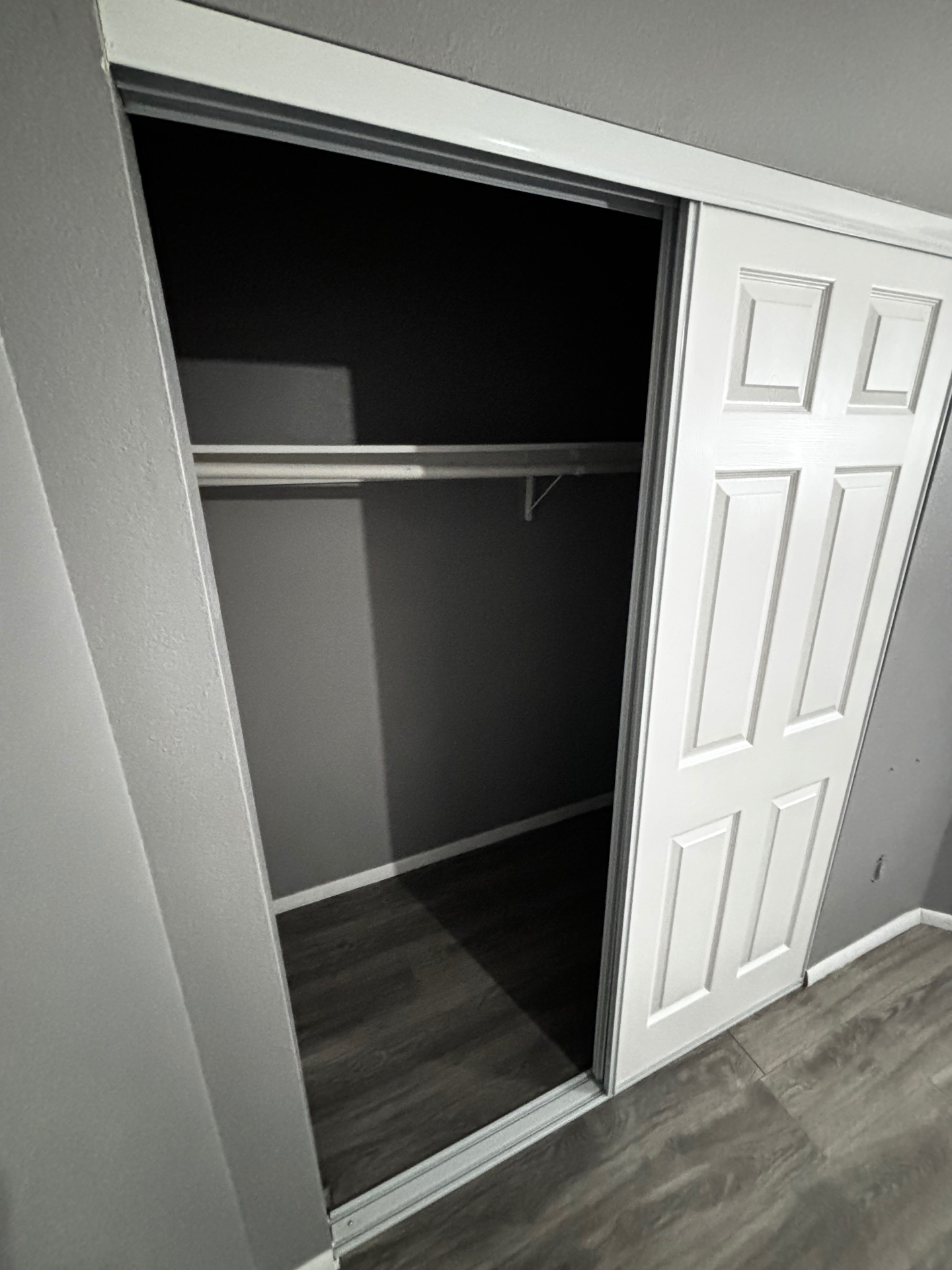 Finished closet with new sliding doors and flooring