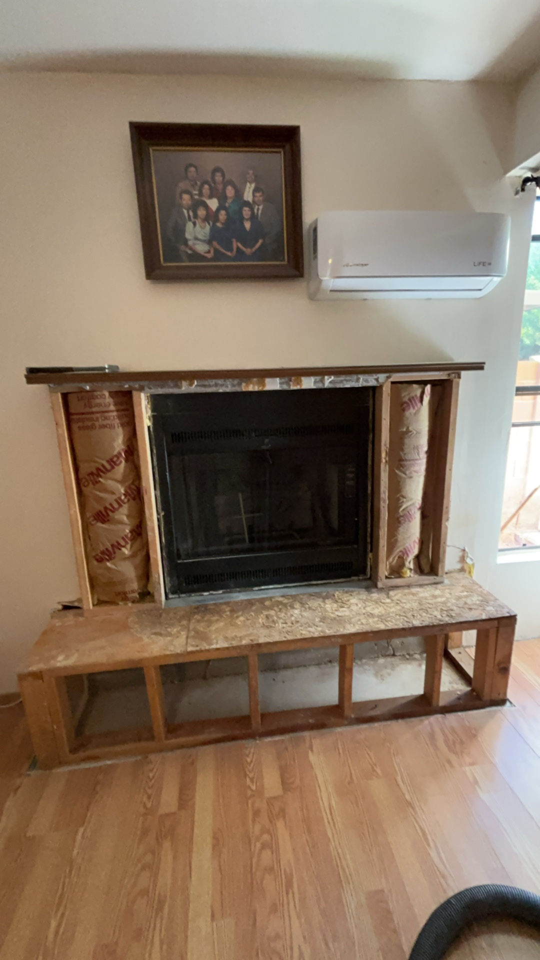 Existing fireplace prep work with hearth opened up for remodel