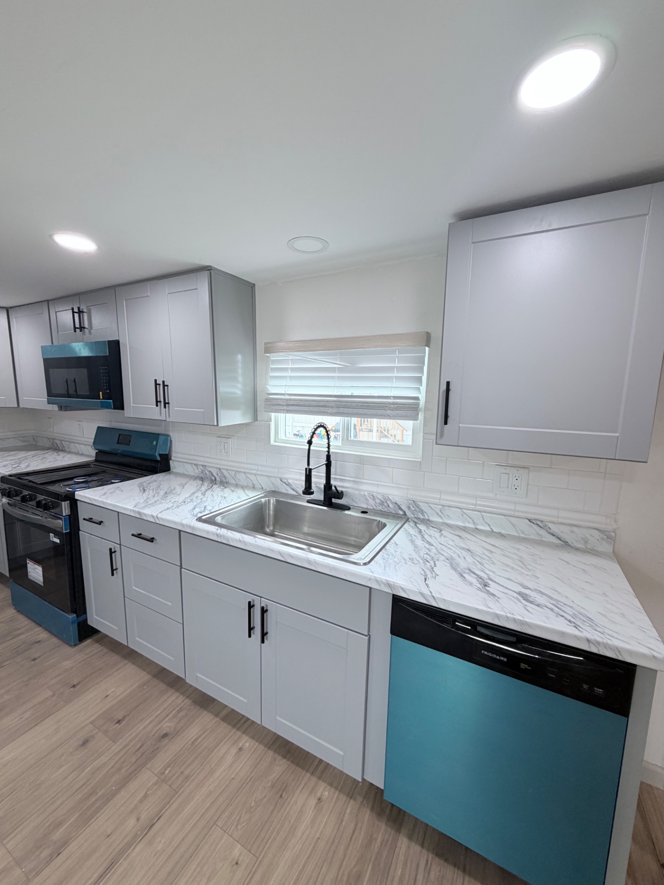 Finished kitchen sink and subway tile backsplash