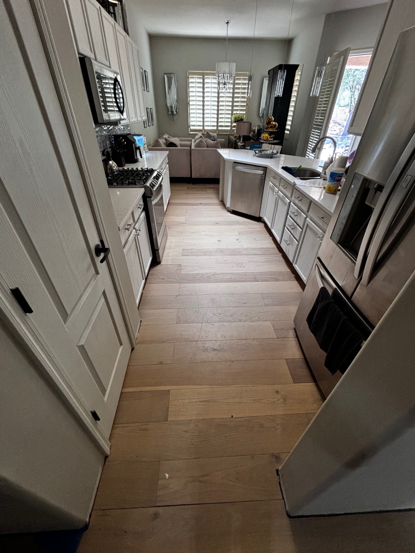 Finished hardwood flooring through kitchen