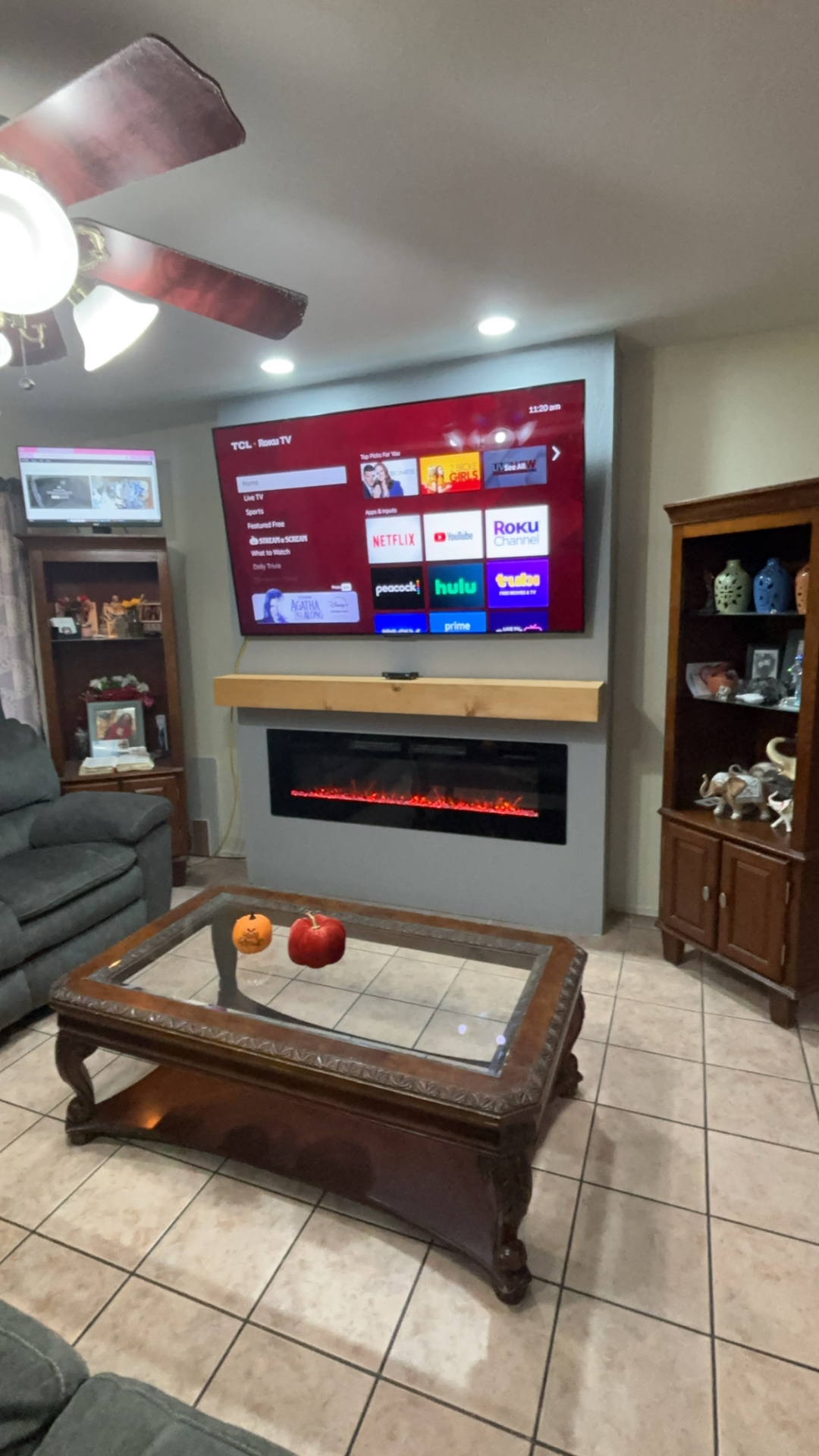 Finished electric fireplace wall with TV and mantel