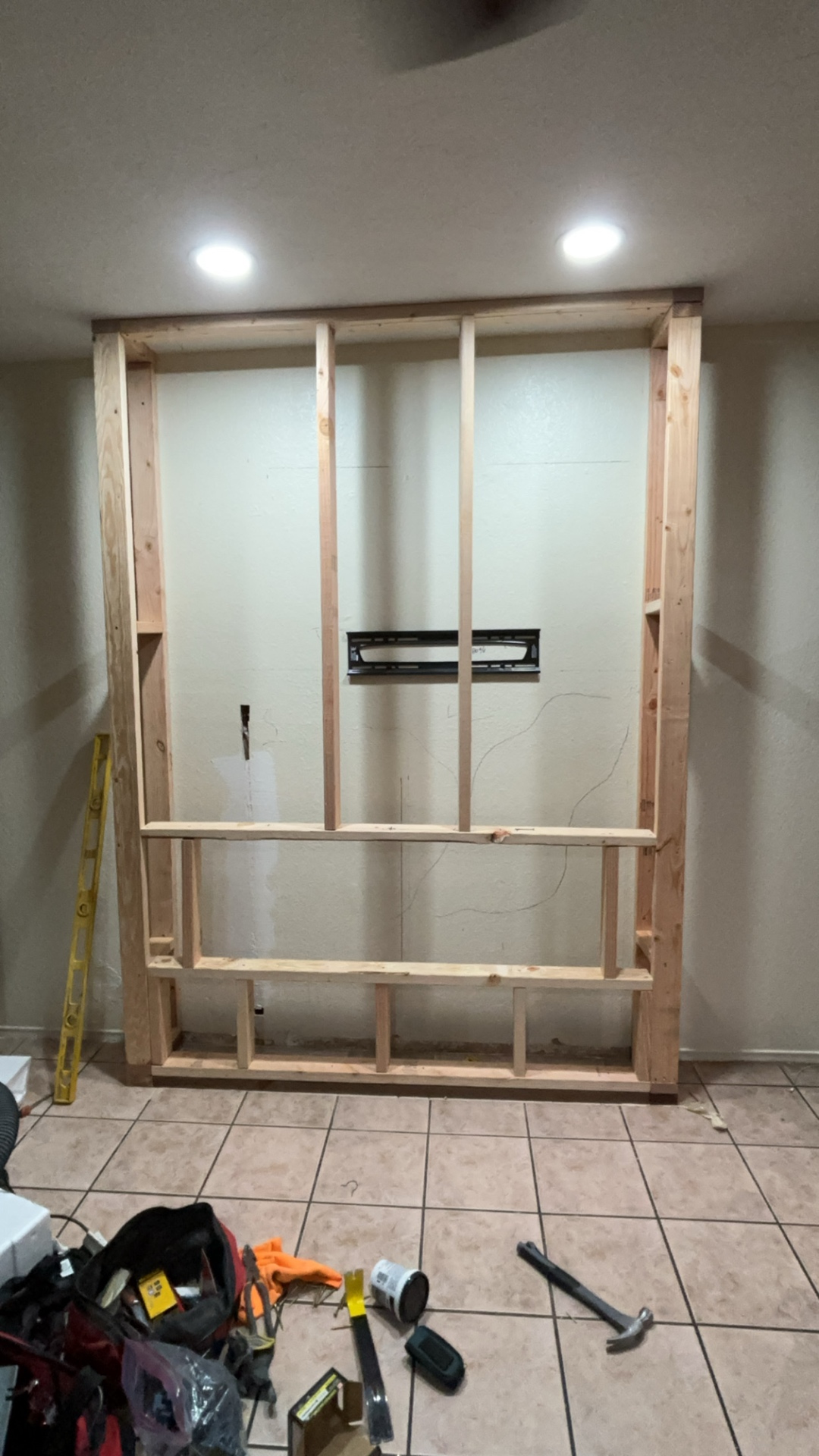 Fresh electric fireplace install with new wall framing