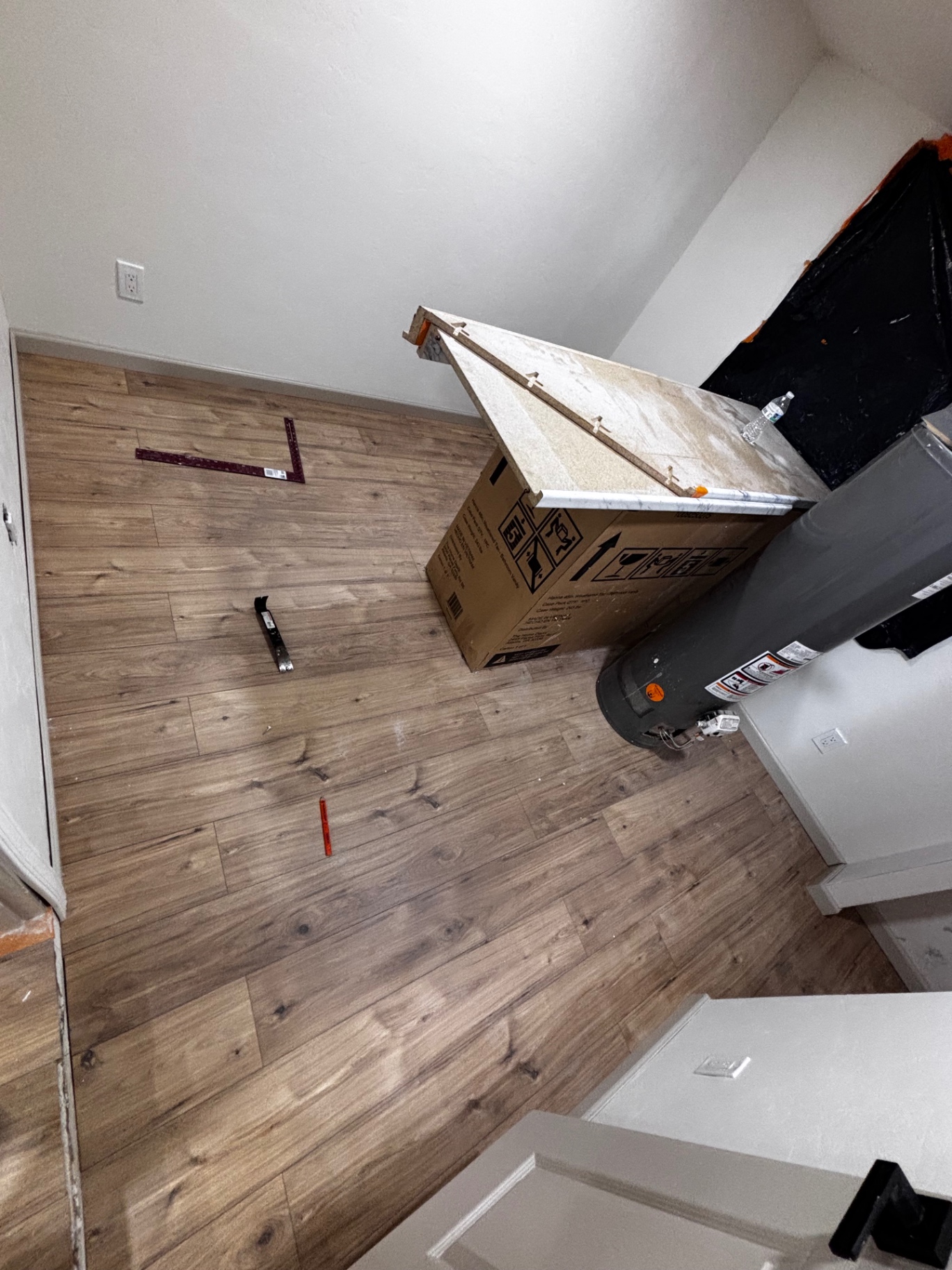 Room mid-install with flooring laid out
