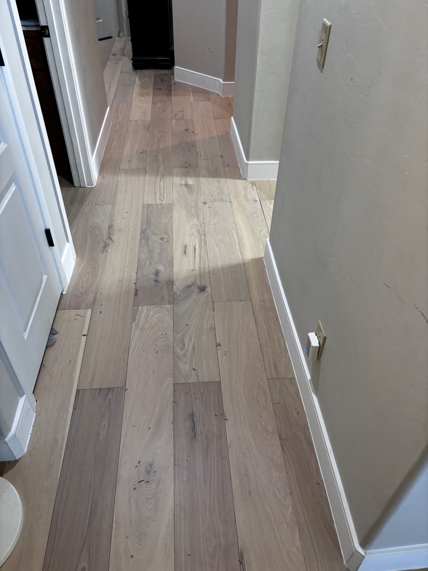 Finished hardwood flooring in hallway