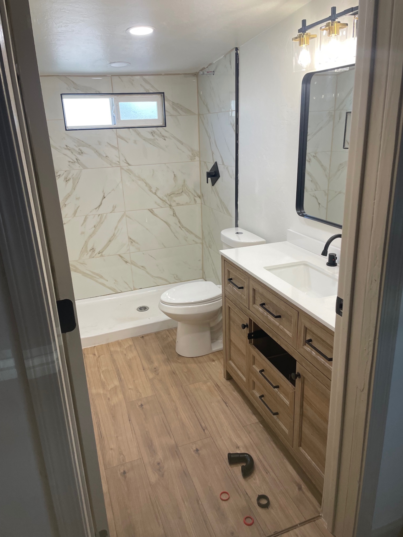 Finished bathroom with walk-in shower and vanity