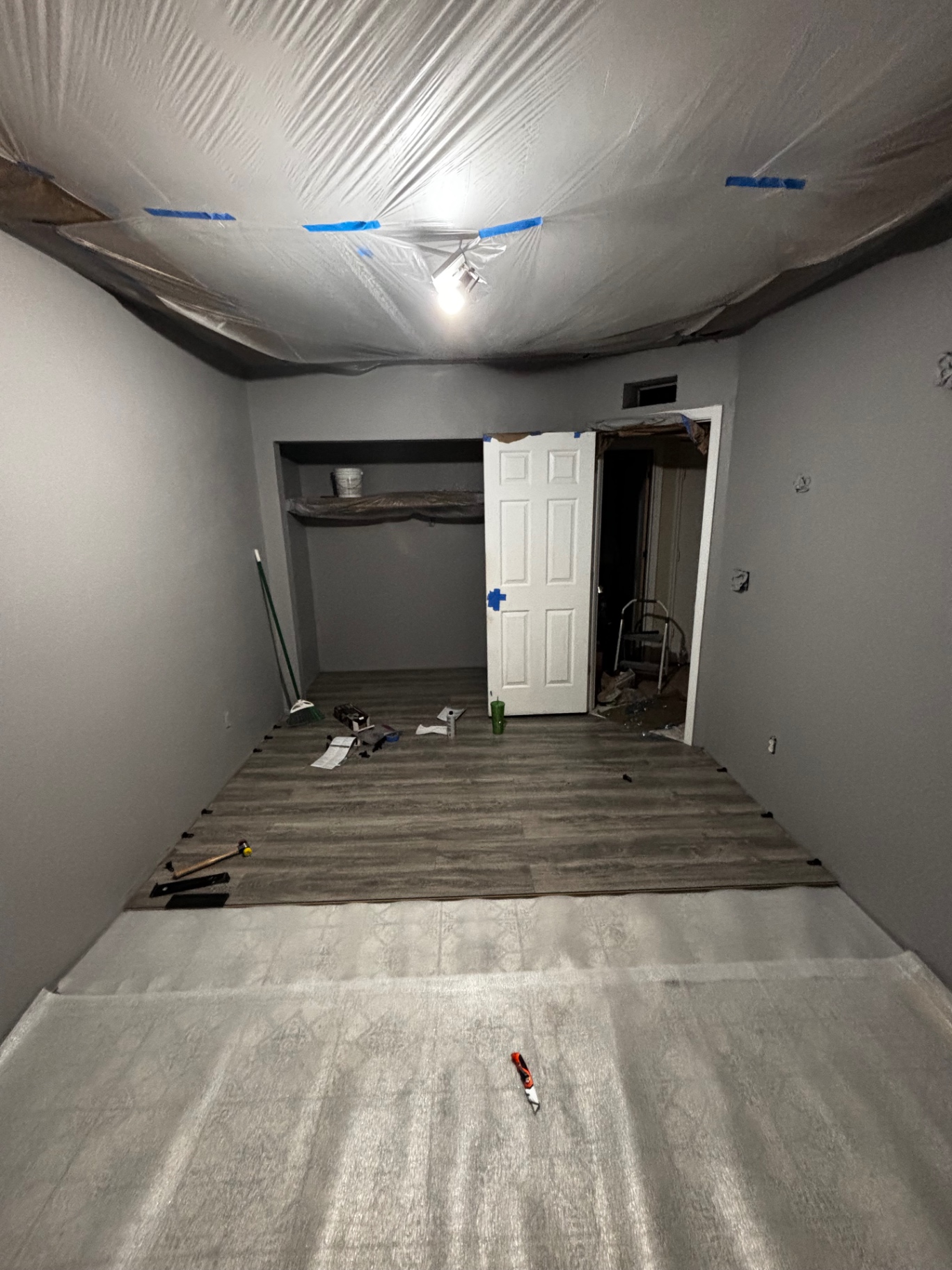 New wood-look plank flooring being installed