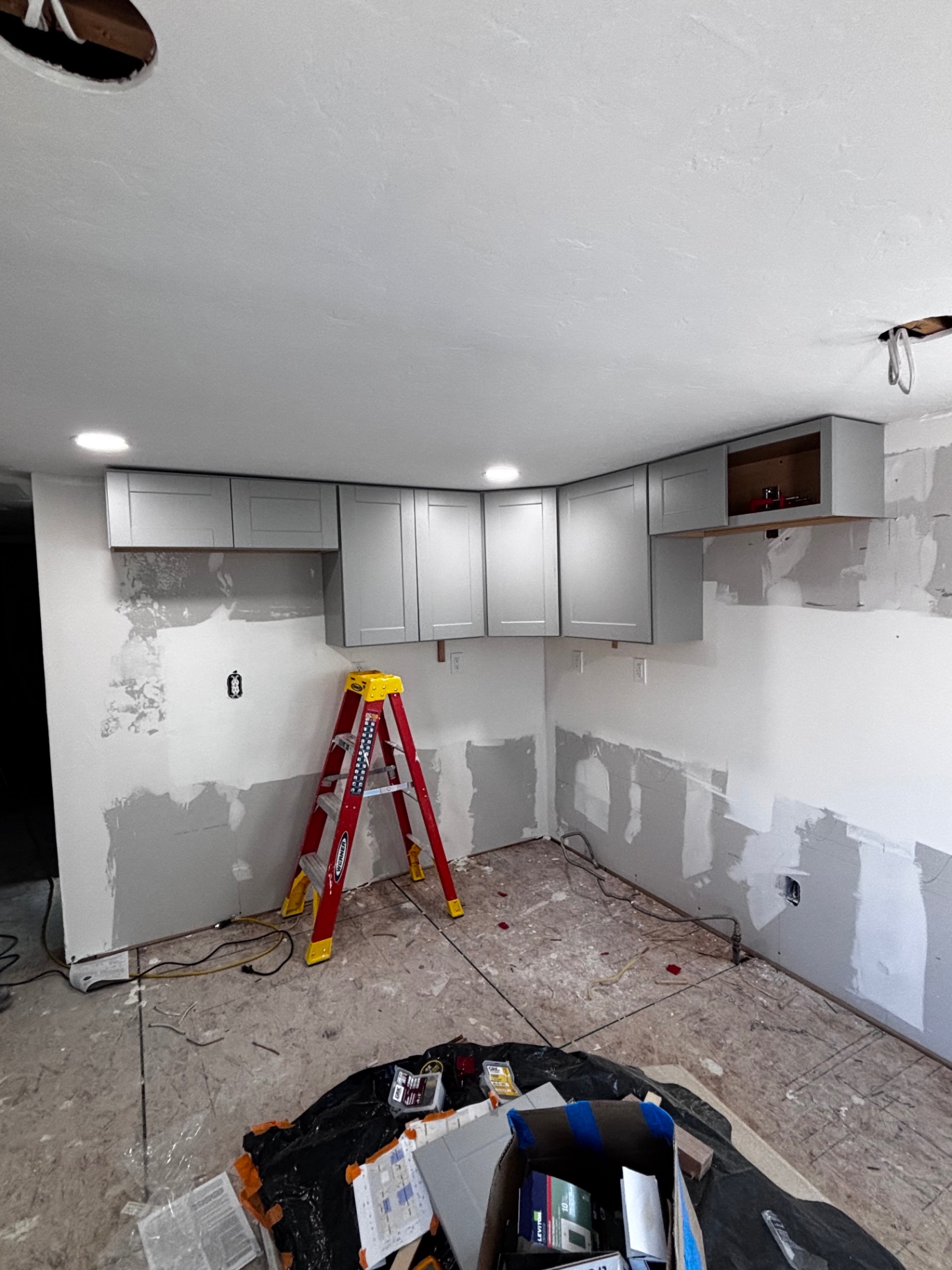 Kitchen demo with new upper cabinets installed