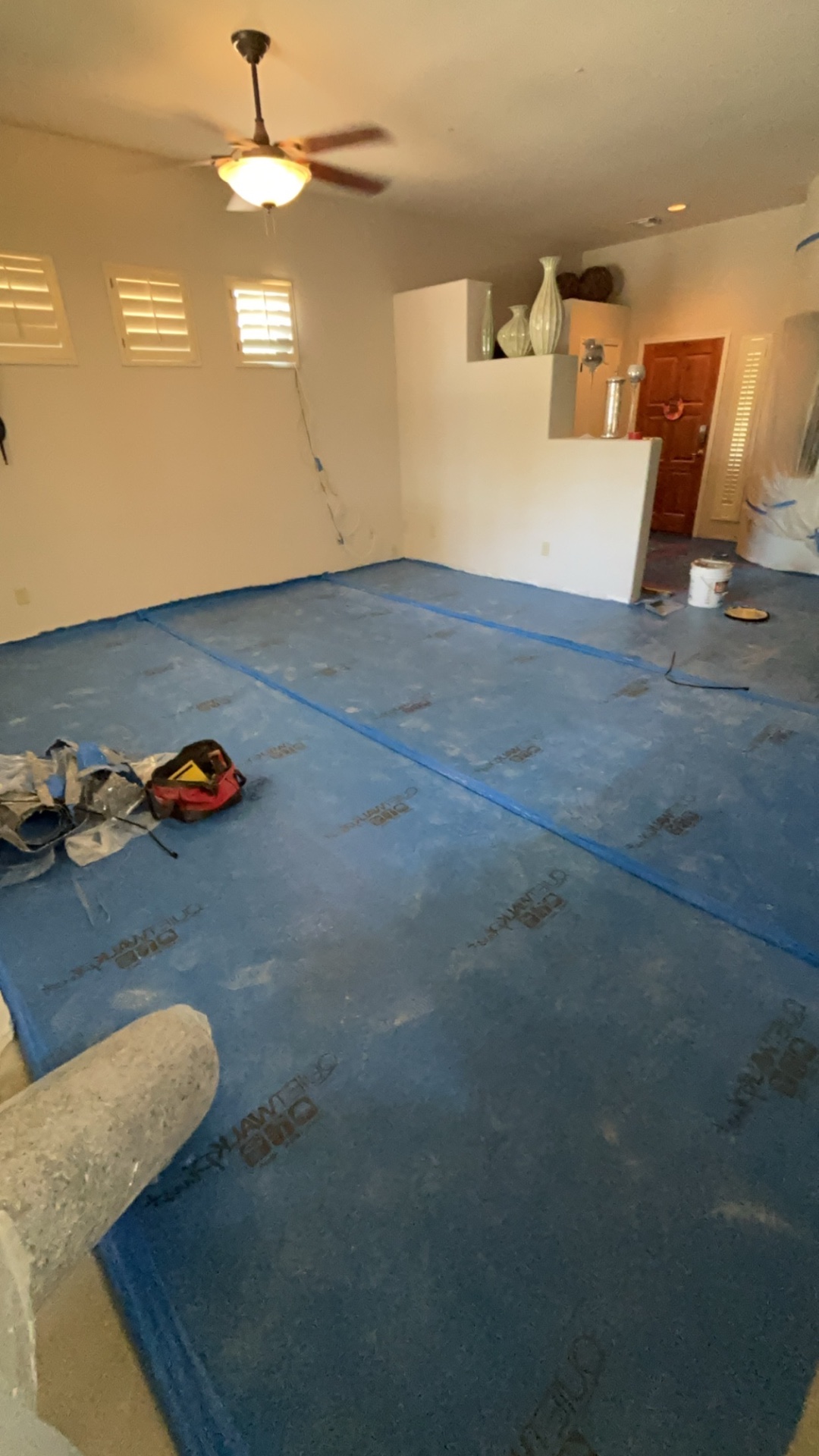 Living room with subfloor underlayment prep