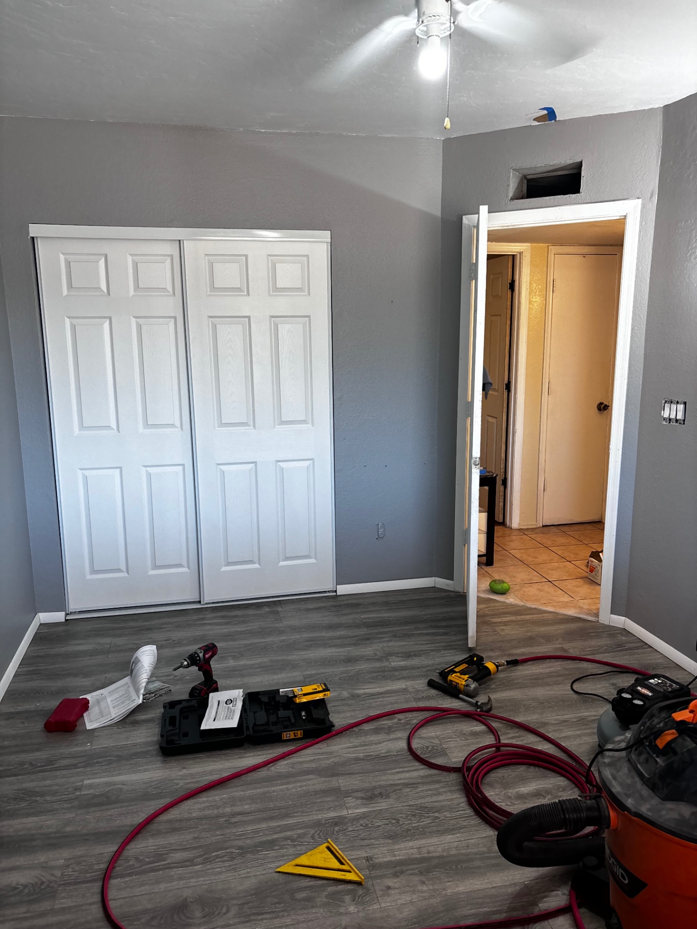 New closet doors installed with finished flooring